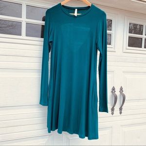 S•H•E• long sleeve dress with pockets and cut out on the back